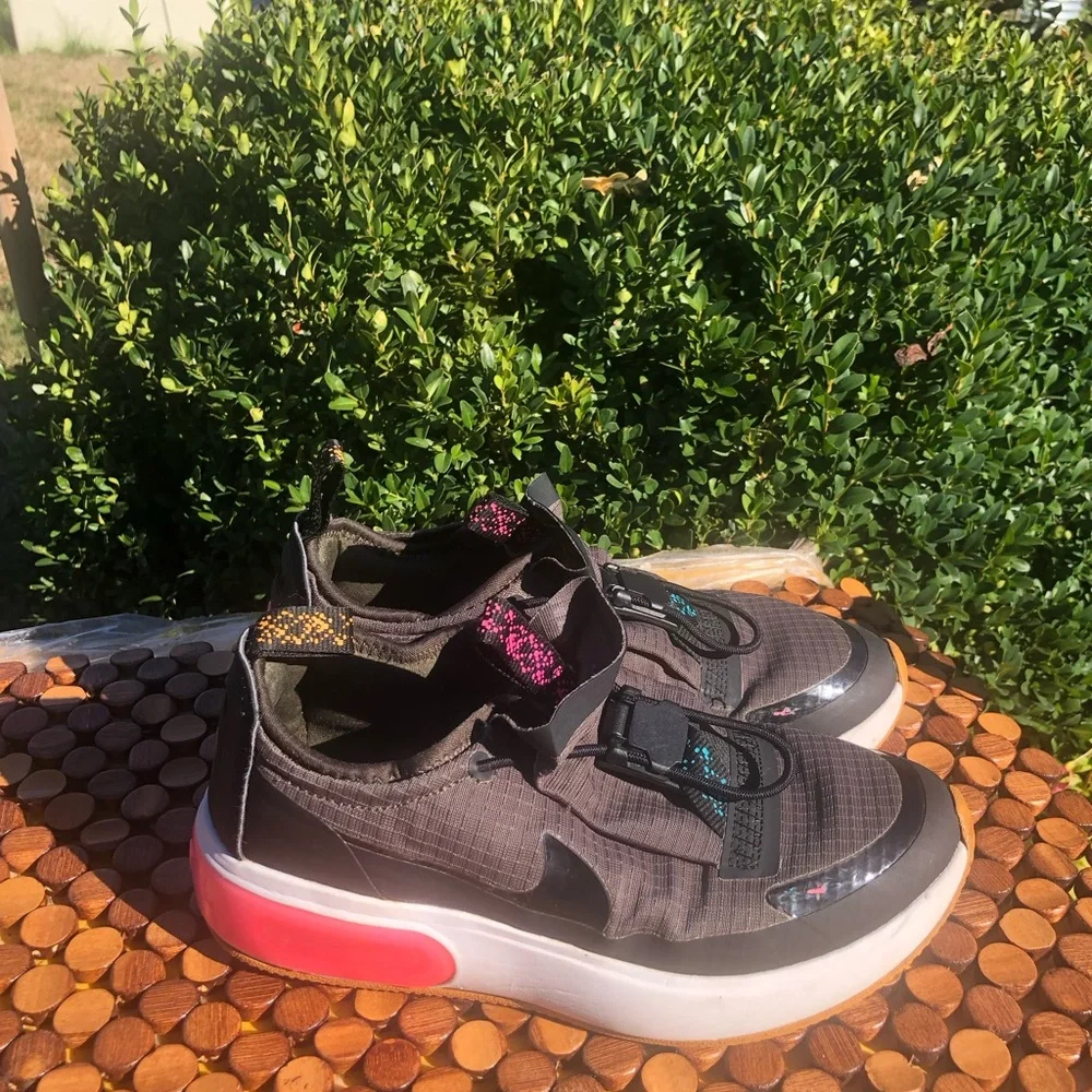 Nike Kids Gray Slip-On Sneakers with Pink Heel Accent